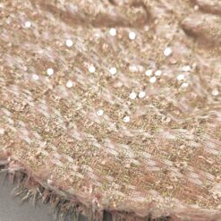 Zartrosa Baumwoll-Bouclé Stoff mit Pailletten und goldenen Fäden