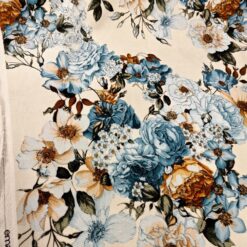 Samt Stoff creme mit blau-türkisen Blumen